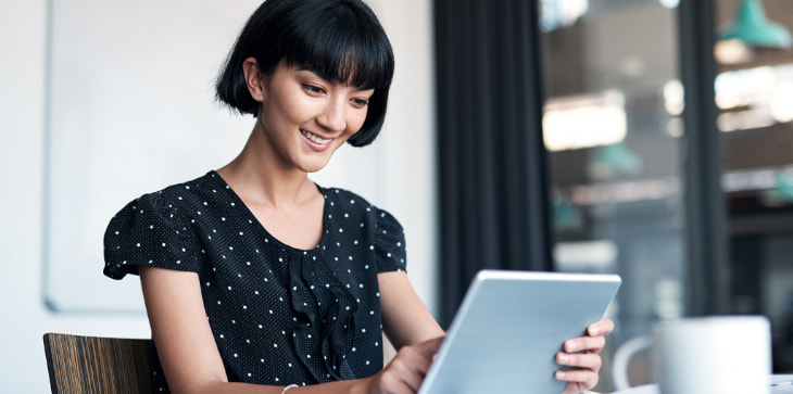 Young woman looking at laptop
